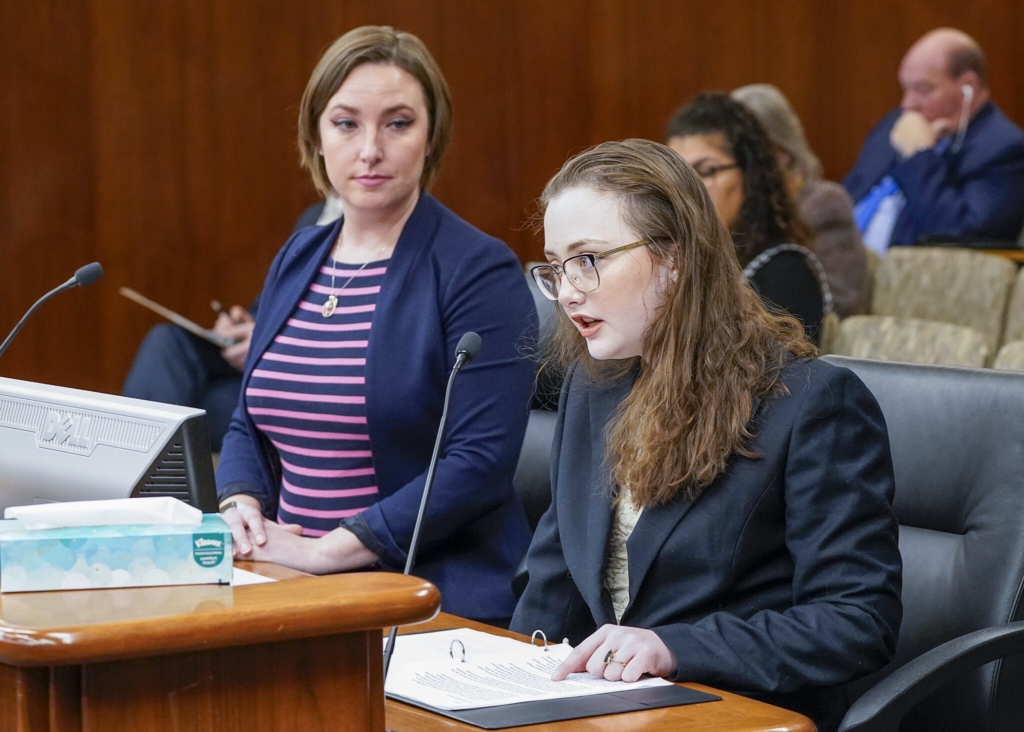 Amara Strande (right) testifies before the House Environment and Natural Resources Finance and Policy Committee Jan. 31 in support of a bill that would prohibit PFAS in children’s products. Copyright Minnesota House of Representatives. Also pictured is Rep. Carlie Kotyza-Witthuhn, DFL-Eden Prairi. Photo by Andrew VonBank