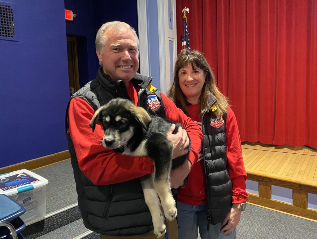 John Clay (holding 11-week-old puppy Mr. Jefferson) and Sheryl Cater.