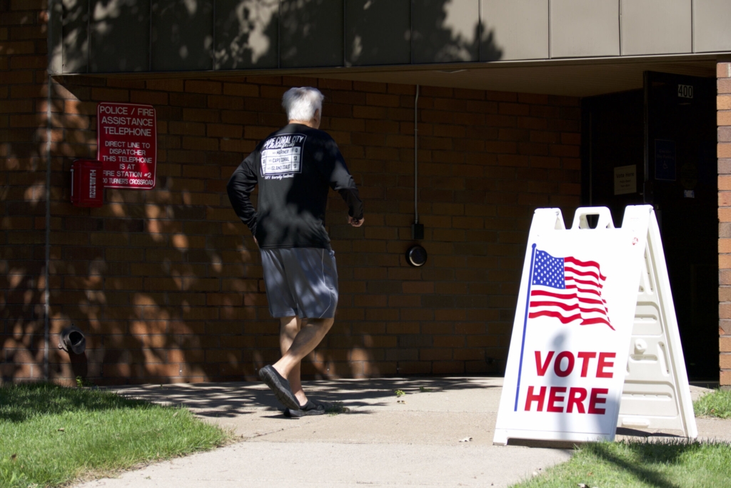 A voter heads into a polling place at a fire station in Golden Valley on Aug. 9, 2022. Photo by Max Nesterak/Minnesota Reformer
