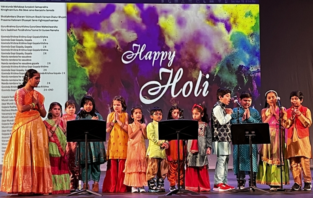 Children from HATS School celebrate Holi with an invocation on March 18. (From left) Viashnavi, Bailey, Sunaina, Mahi, Nicole, Risha, Seyash, Zaysha, Diva, Reyansh, Atharva, Neeva, and Sharva. Photo by Nitin Nagpal