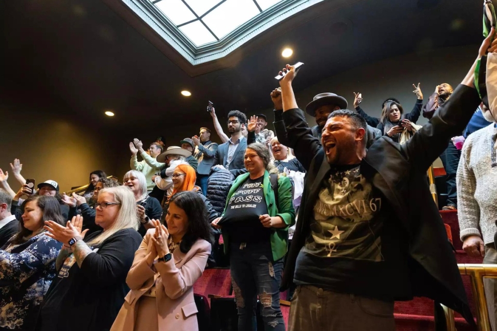 Supporters celebrate as the Senate passes its version of the adult-use marijuana bill at the Minnesota State Capitol on Friday, April 28. Credit: Ben Hovland | MPR News