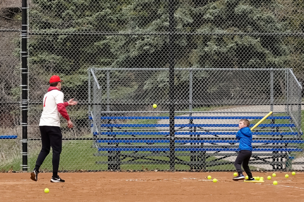 Adam Mertens pitches the ball to Lincoln Peterson during the Eden Prairie Baseball Association's Opening Day celebration on Saturday, April 29, at Miller Park. Photos by Gretchen Haynes