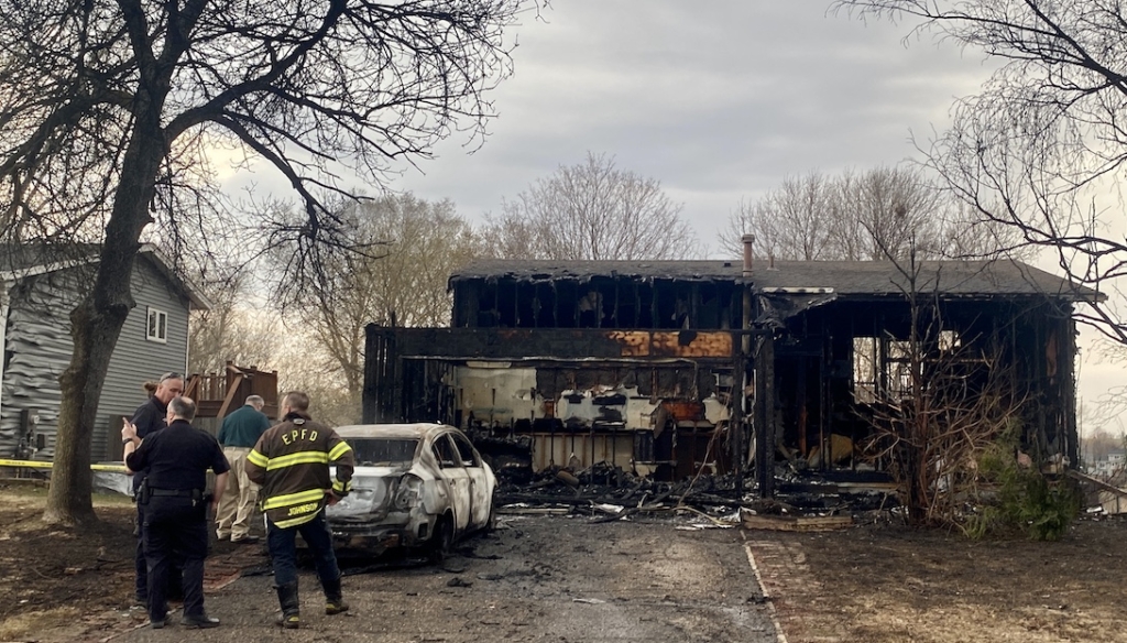 The wreckage of a house after a fire destroyed it.