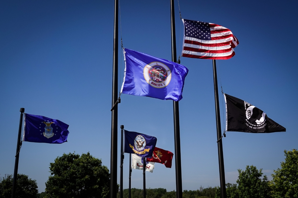 Flags raised to half staff before the Memorial Day Ceremony begins at the Eden Prairie Veterans Memorial at Purgatory Creek Park.