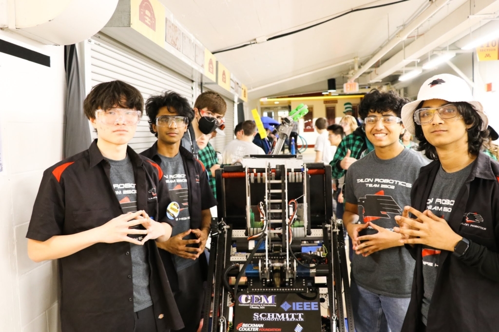 Members of EPHS' Talon Robotics Team with their robot. Photos and video contributed by Talon Robotics