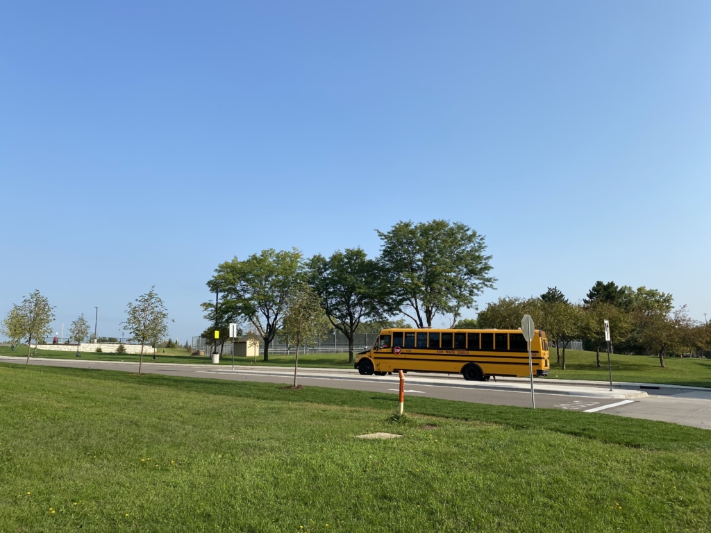 A Central Middle School (CMS) bus transports students to the school on the first day of the academic year last September. File photo by Juliana Allen