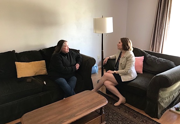 Onward Eden Prairie's Executive Director, Tricia Wright (right), and program manager, Corey Sentier, discuss the organization's mission in the nonprofit's Eden Prairie house, which provides stable housing for young adults experiencing homelessness. Photo by Greg Olson