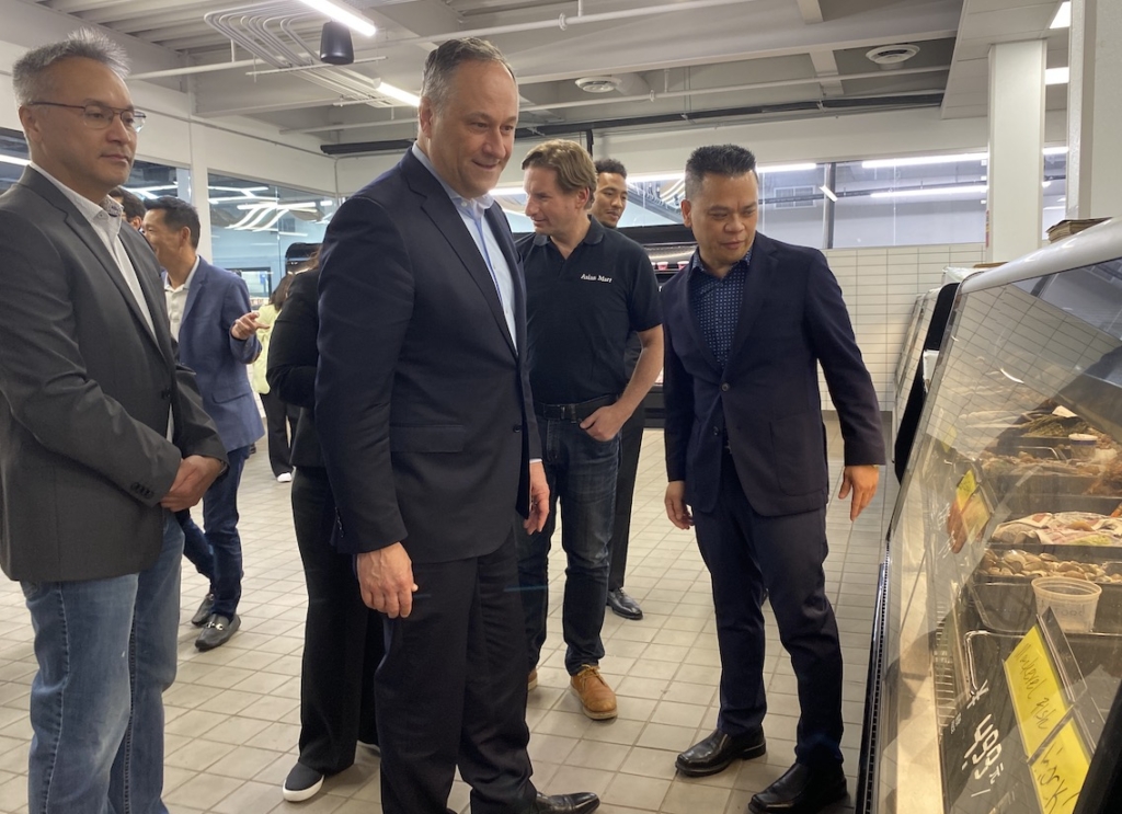 Second Gentleman Doug Emhoff (middle) during his tour of Asia Mall, with Pho Mai owner Michael Bui to his left and U.S. Rep. Dean Phillips and Amor Zhao, one of the mall's owners, to his right.