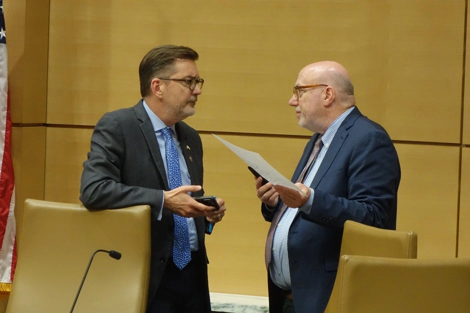 Minneapolis DFLers Sen. Scott Dibble and Rep. Frank Hornstein, chairs of the Legislature's conference committee on transportation, confer the weekend before the expected adjournment of the legislative session. Peter Callaghan | MinnPost