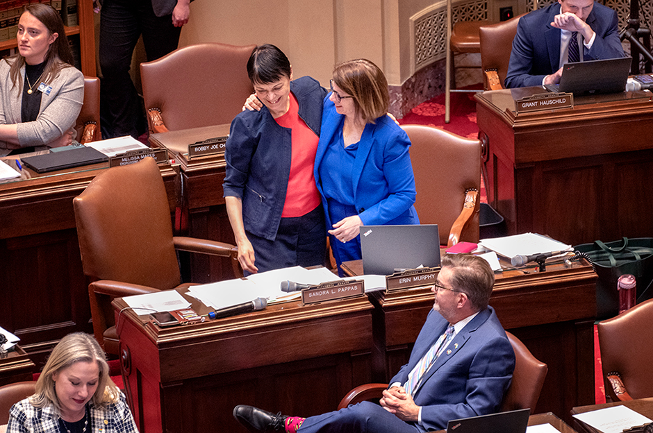 State Sen. Sandy Pappas receiving a hug from state Sen. Erin Murphy following the passage of the bonding bill. MinnPost photo by Tom Olmscheid