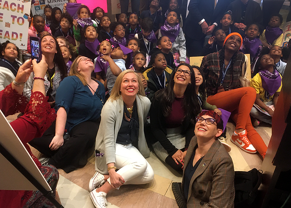 In front: state Rep. Heather Edelson, state Sen. Erin Maye Quade and state Rep. Sandra Feist celebrated Literacy Day in the Capitol Rotunda in April. MinnPost photo by Peter Callaghan