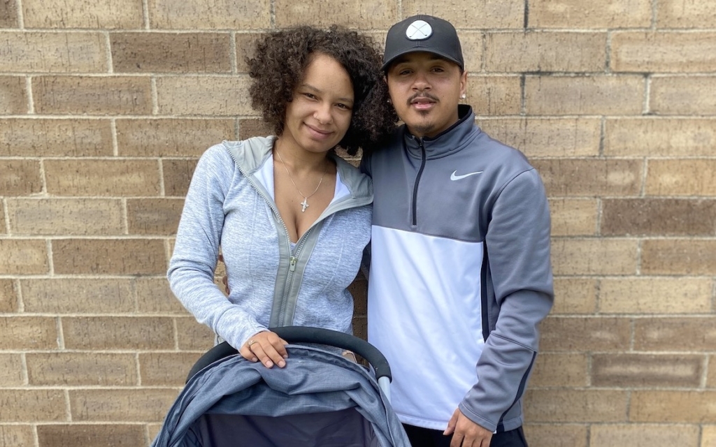 Sade Strong, with her fiancee Nathaniel Hawkins and Skylynn, their 1-month-old daughter, stand in front of a brick wall outside a Starbucks near Eden Prairie Center mall on Wednesday, June 7. Photo by Stuart Sudak