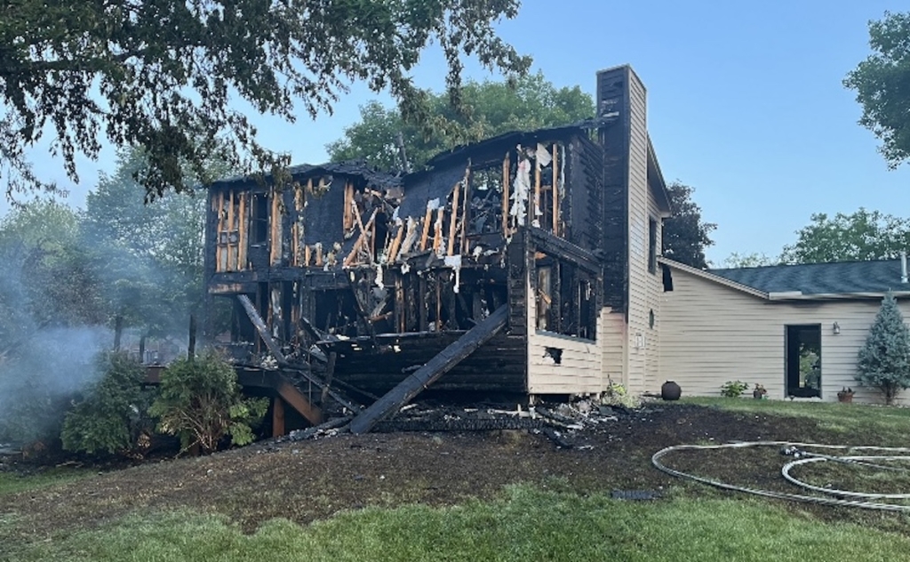 The charred ruins of a house damaged by a late-night fire on Tuesday.
