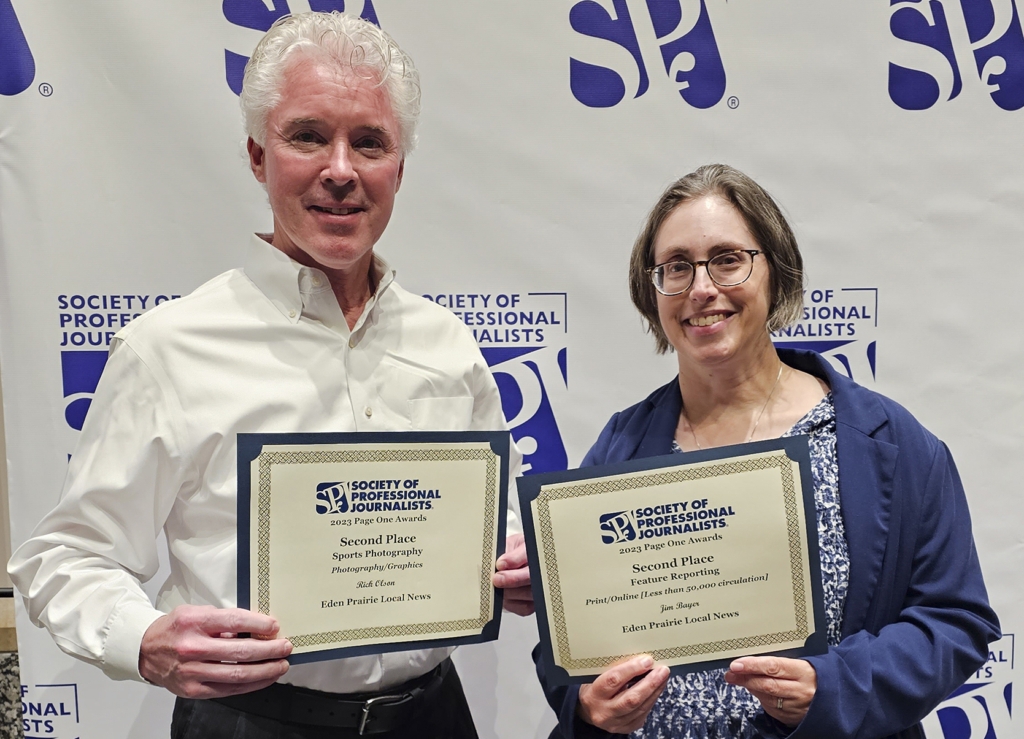 EPLN photographer Rick Olson, left, received second place in the Sports Photography category. Co-editor Joanna Werch Takes, right, accepted a second place award in feature reporting on behalf of reporter Jim Bayer, who was unable to attend the event.
