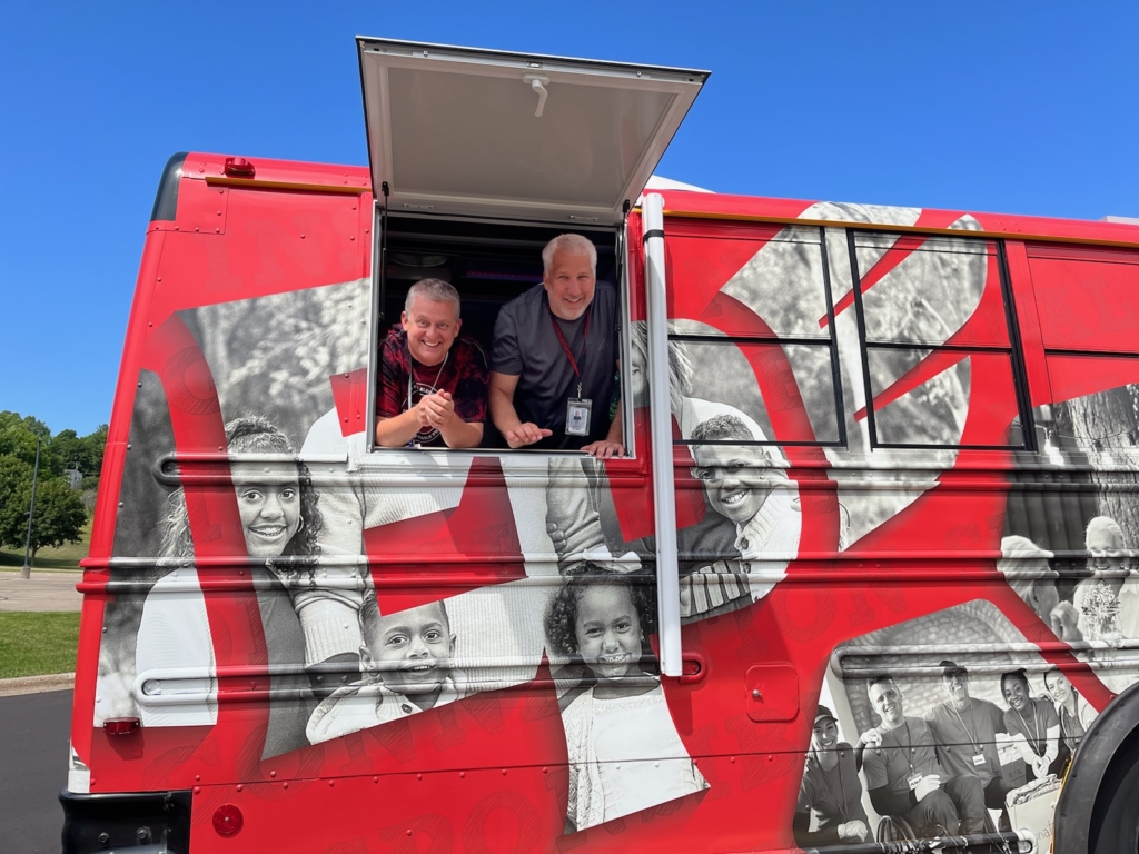 Forest Hills Elementary's associate principal Tom Walters (left) and principal Joel Knorr in the Eagle Express. Photo from EPS Community Education