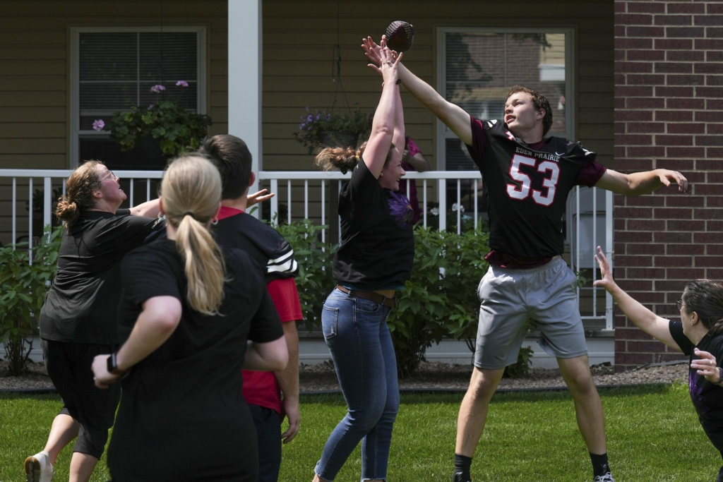 The Waters' quarterback launched a Hail Mary pass that soared over the outstretched hand of Eagles senior Vinny Dykstra. Photo by Rick Olson