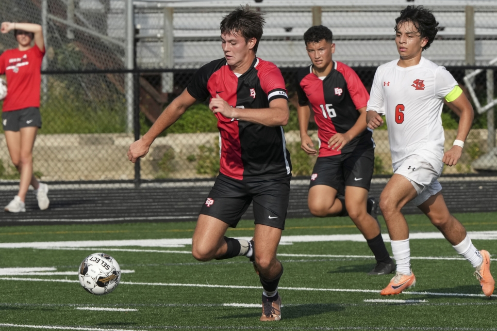 Eden Prairie High School senior forward Ryan Donohue (10) in action during Thursday's game, where he scored all three goals for the Eagles. Photo by Rick Olson