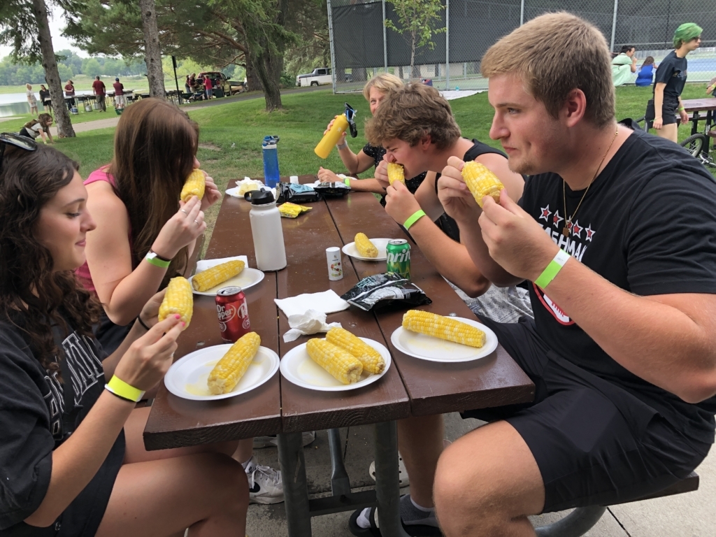 Enjoying their corn are, clockwise from left, Annabelle Boudreau, Audrey Lybeck, Liz Marty, Will Diana, and Ethan Sims. 