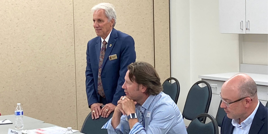 Eden Prairie Mayor Ron Case (left) welcomed Aaron Casper (center), chair of the Eden Prairie School Board; Steve Bartz (right), a school board director, and other school and city officials to an informal joint meeting at city hall on Tuesday, Aug. 15. Photo by Mark Weber