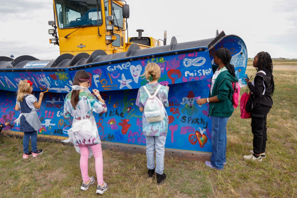 Children participate in last year’s Girls in Aviation Day at Flying Cloud Airport. File photo by Gillian Holte