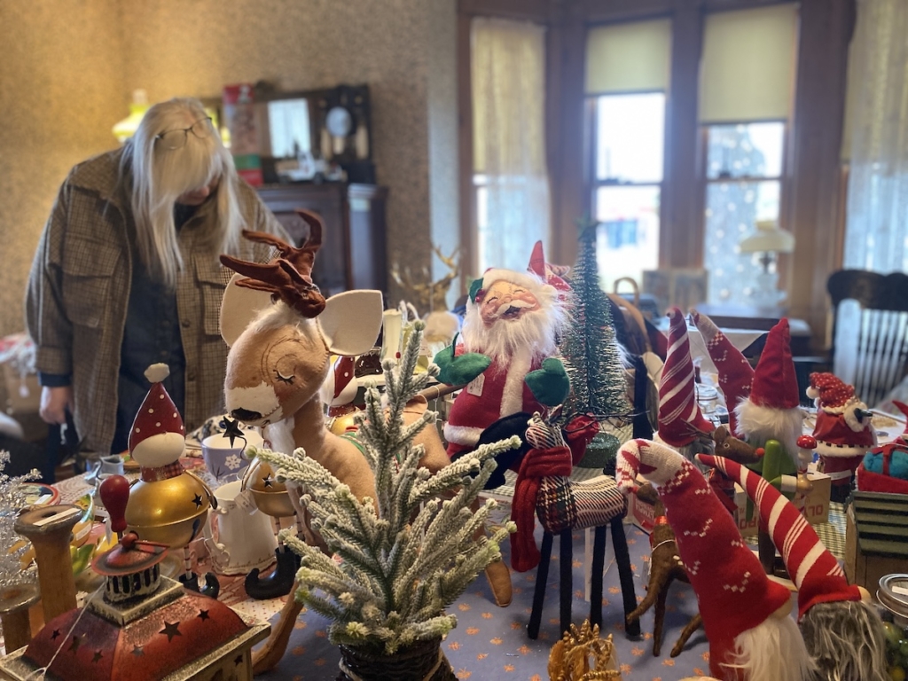 Shoppers browse vintage Christmas decorations at the Cummins House Vintage Sale