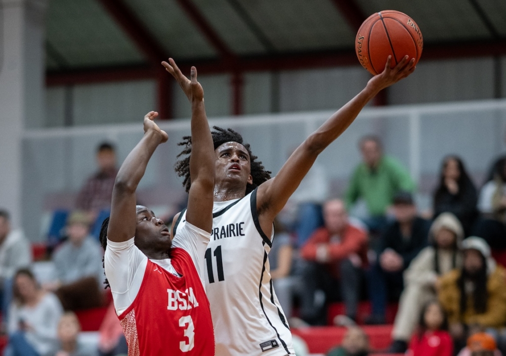 Eden Prairie High School boys basketball sophomore guard Hamze Yusuf leaps toward the basket in Thursday's game against Benilde-St. Margaret.