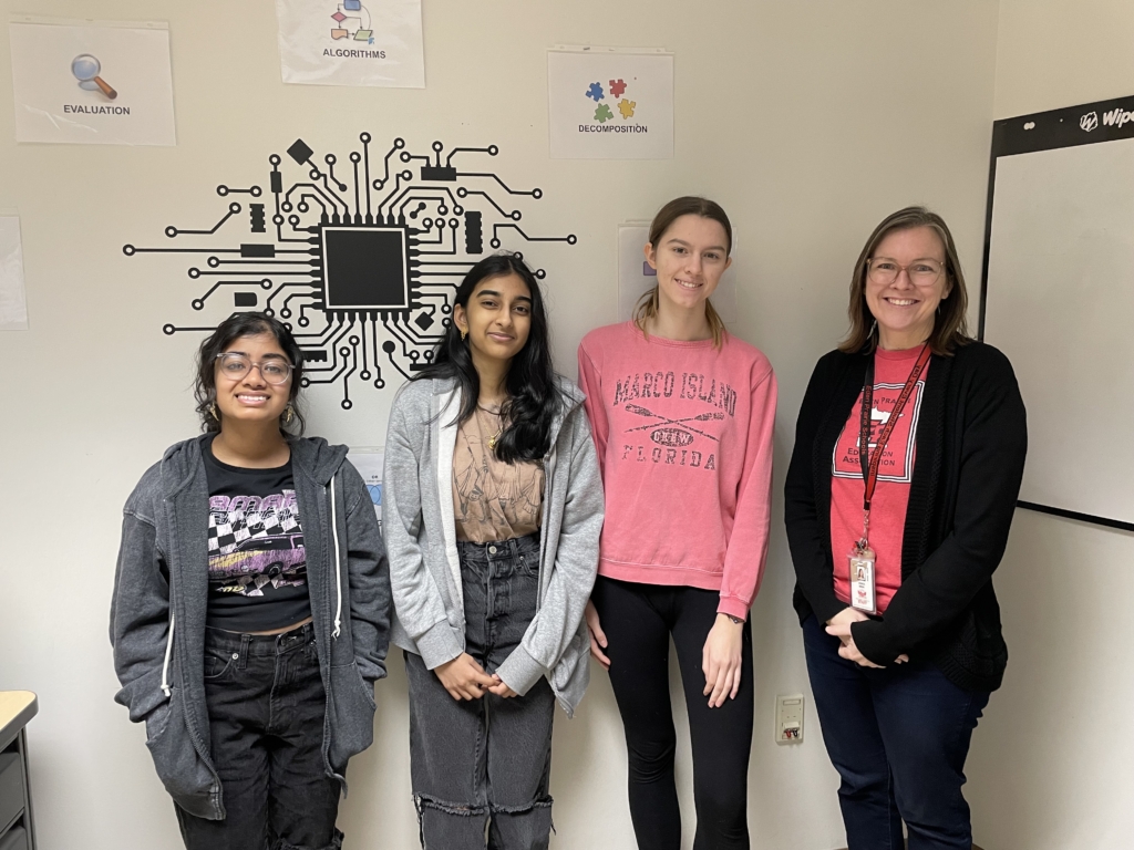 (From left) Eden Prairie High School seniors Lisa Thayil, Anjali Marella, and Jasmine Garry, along with computer science teacher Jessica Brent. Contributed photo