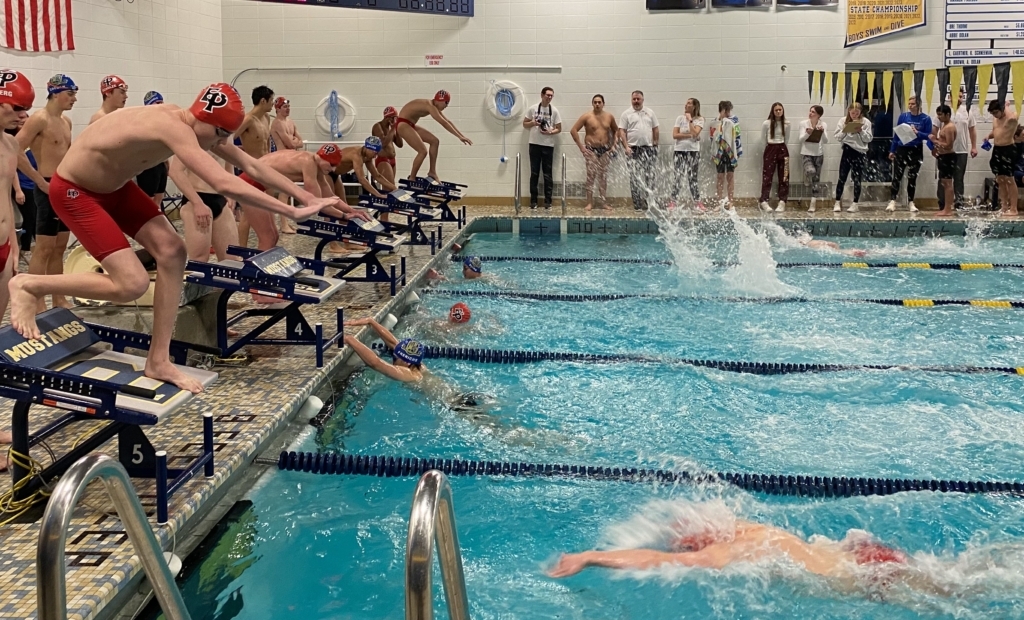 Freshman Jack Kevan (lane 5) prepares his 200 free relay start in the Breck-Blake meet. Photo by Juliana Allen