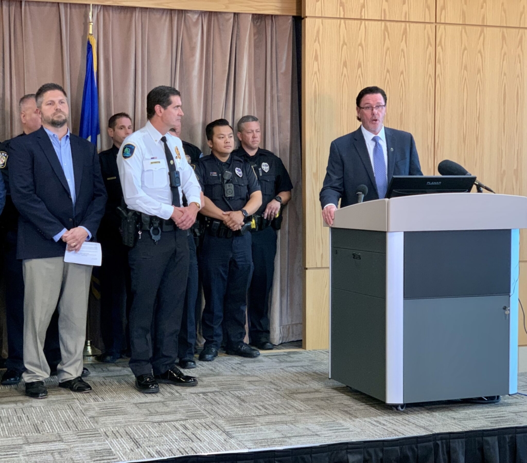 Minnesota Chiefs of Police Association Executive Director Jeff Potts, surrounded by officers, spoke at a press conference at Anoka County Sheriff’s Office on Sept. 13, 2023. Photo by Michelle Griffith/Minnesota Reformer