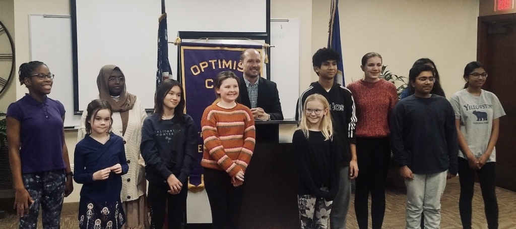 Eden Prairie Optimist Club member Ryan Affolter (middle) with past essay contest winners. Submitted photo