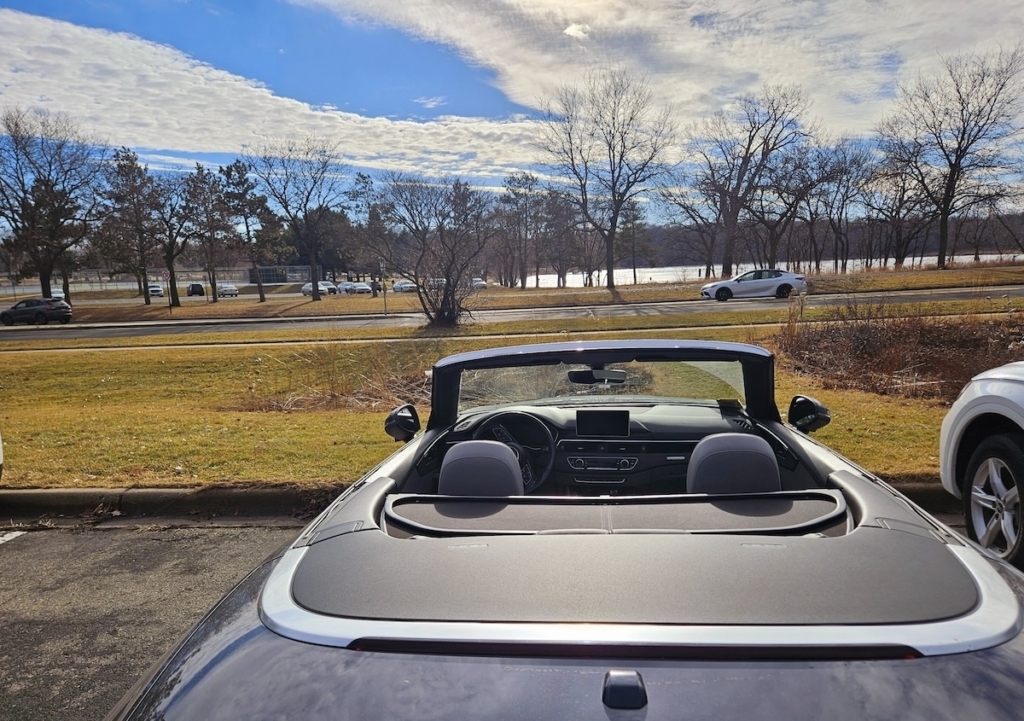 A convertible sits with its top down in the Eden Prairie Community Center parking lot on Monday, Jan. 29, with Round Lake in the background. Photo by Brad Canham