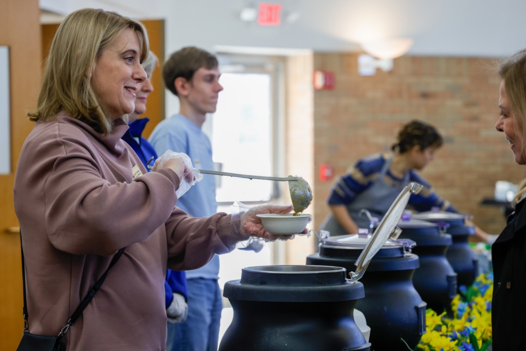 Eden Prairie City Council member Lisa Toomey serves a bowl of soup during last year’s Empty Bowls fundraiser at St. Andrew Lutheran Church in Eden Prairie. File photo by Gillian Holte