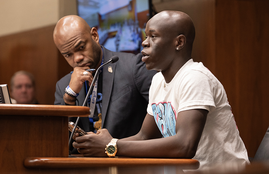 Gabriel, a high school student, testifying during a House Education Policy Committee on Feb. 12. State Rep. Cedrick Frazier is at left. MinnPost photo by Tom Olmscheid