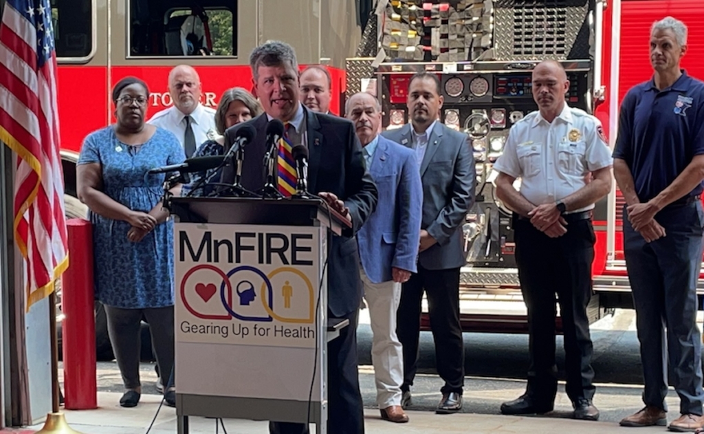 George Esbensen, president of the Minnesota Firefighter Initiative (MnFIRE), speaks at a news conference celebrating the passage of the Hometown Heroes Assistance Program in July 2021. Photo courtesy of MnFIRE