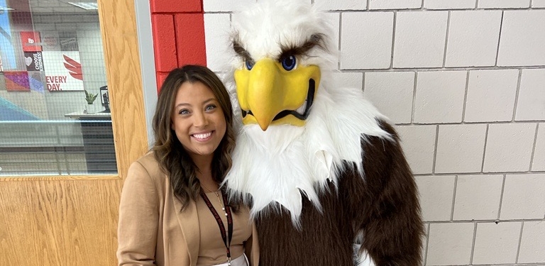Jess Diaz Lawson with the Eden Prairie eagle mascot. Contributed photo