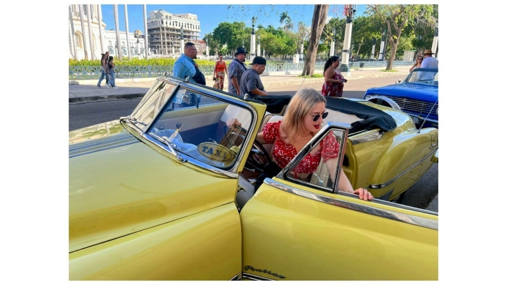 Amy Strate exits a 1950, Pontiac Chieftan that serves as a Havana tourist taxi.