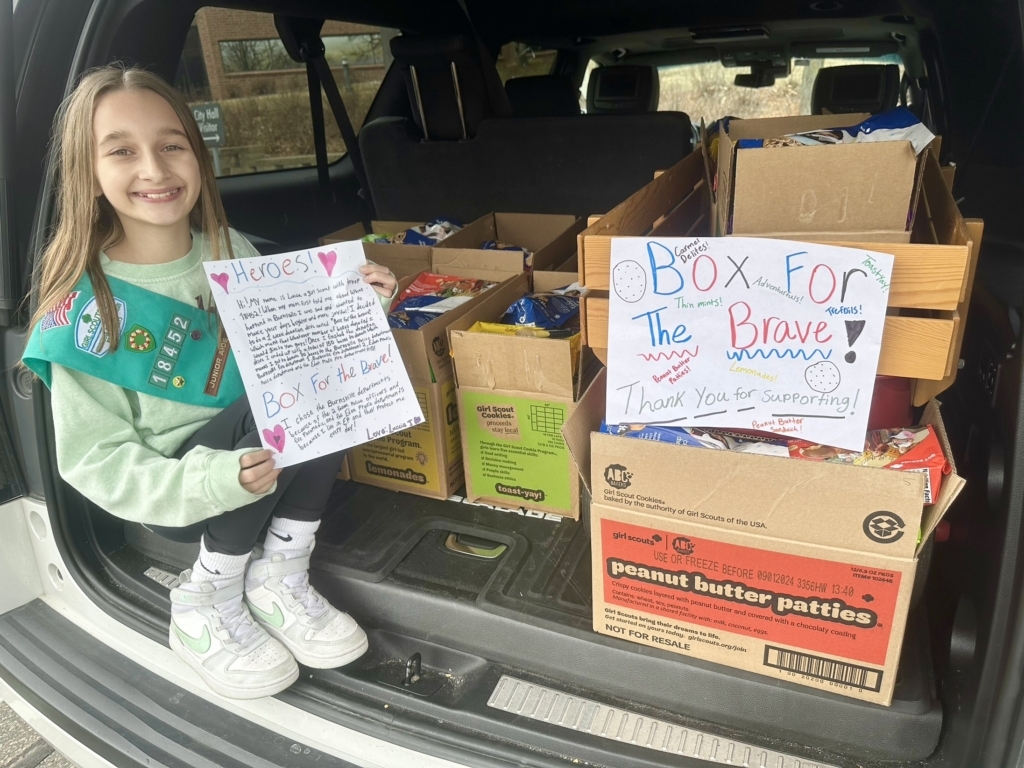 Eden Prairie Girl Scout Luccia Jiovanazzo delivered 150 boxes of donated cookies earlier this month to police and fire departments in Eden Prairie and Burnsville. Photo courtesy of Jennifer Jiovanazzo