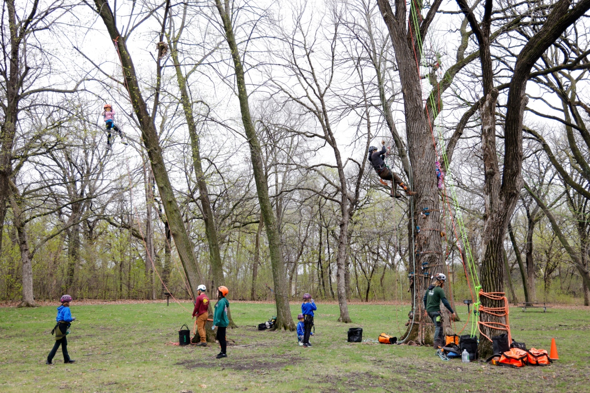 Participants climb trees during Eden Prairie's Arbor Day event at Round Lake Park on April 27. The city celebrated its 40th year as a Tree City USA. Photos by Gillian Holte