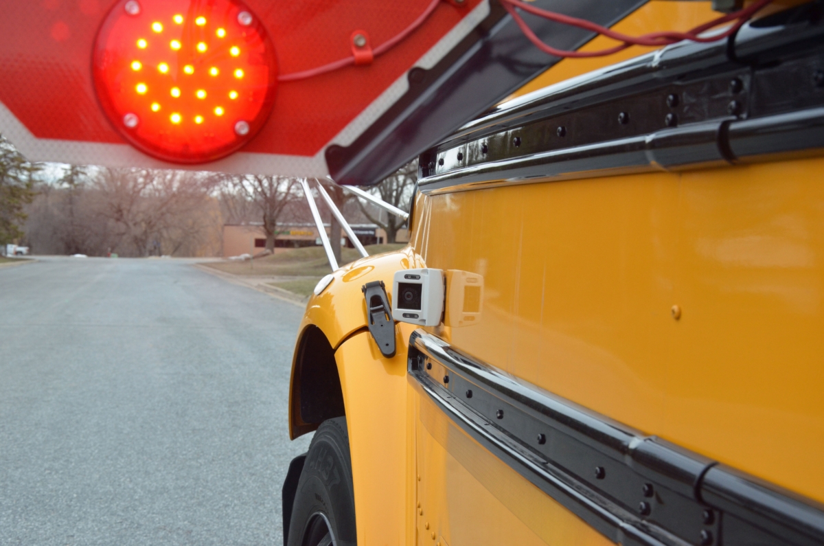A camera is mounted just in front of the stop-arm with flashing lights on an Eden Prairie Schools bus. Photo by Jim Bayer