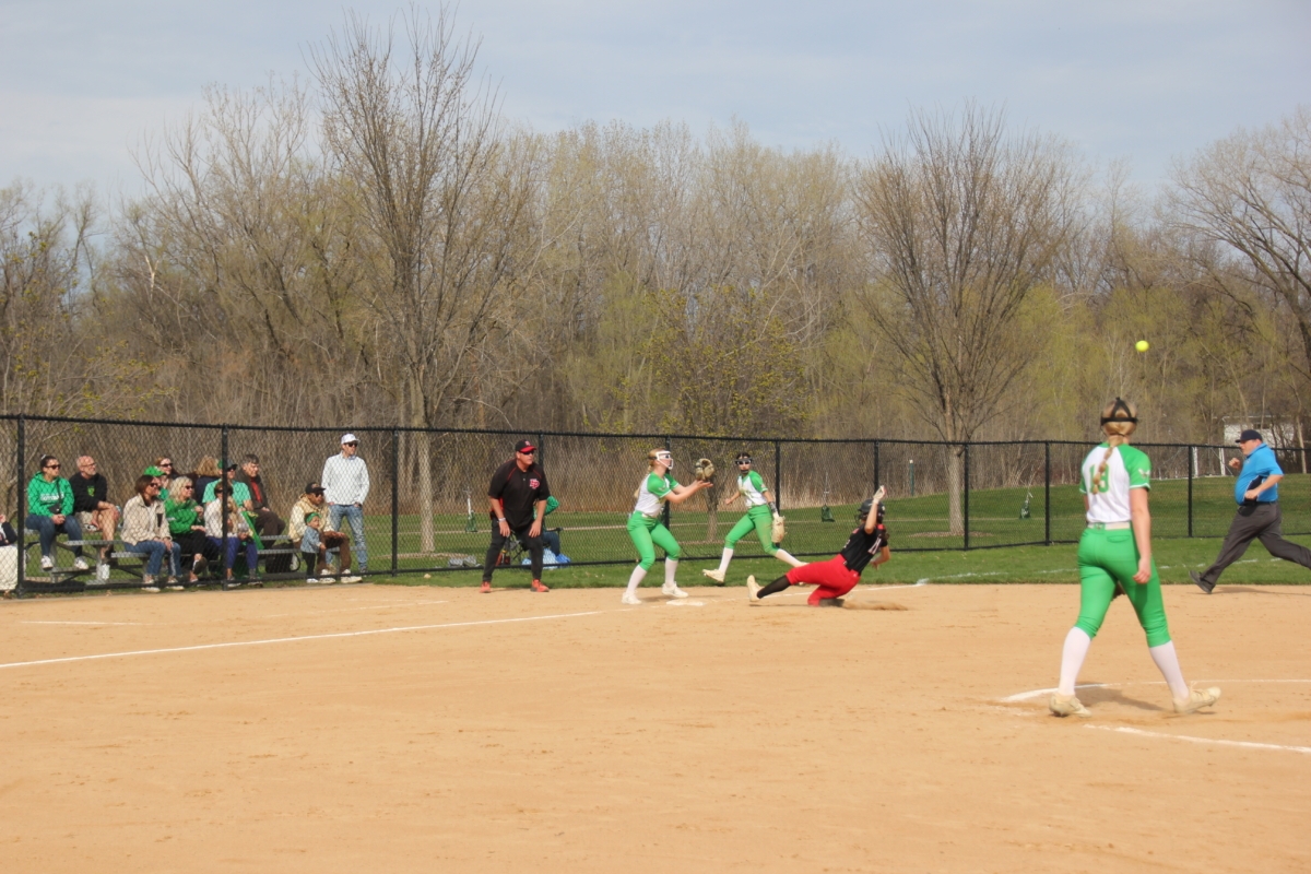 Alex Hall sliding into third after hitting a single. Edina overthrew and she made it to third. Photo by Laura Neuman