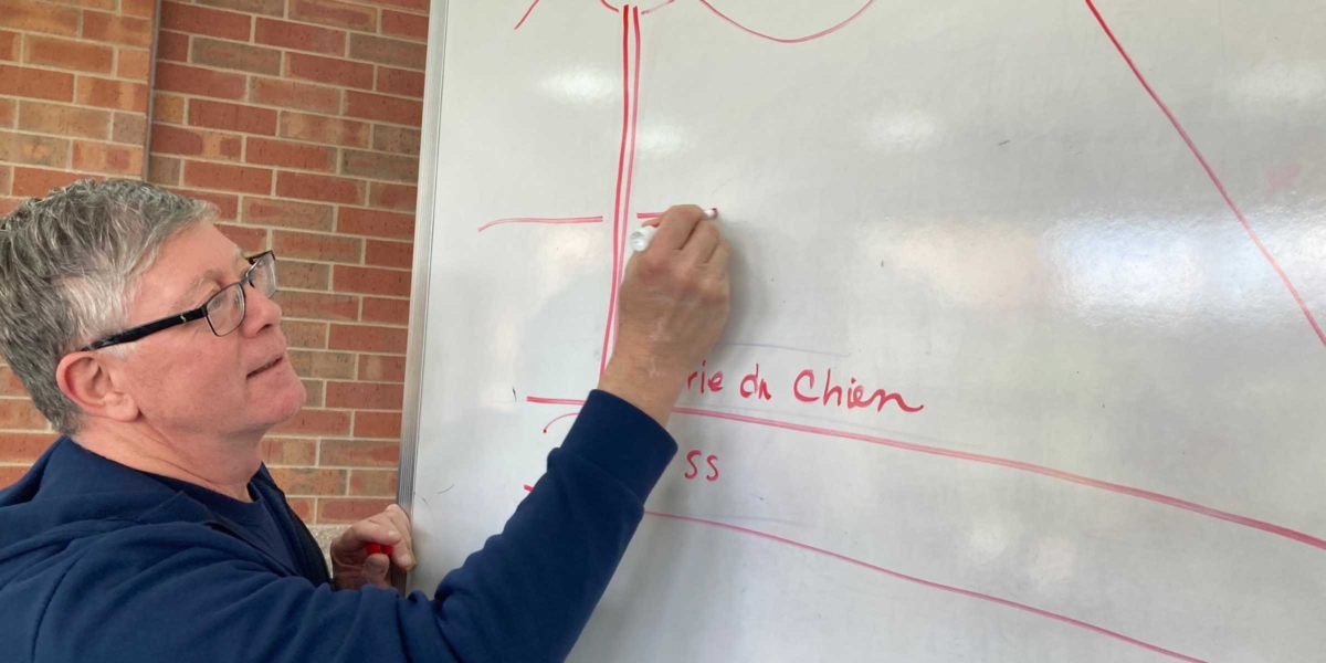 Rick Wahlen, manager of utility operations for the City of Eden Prairie, draws a sketch showing how EP draws groundwater from the Prairie du Chien-Jordan aquifer and treats it to create safe drinking water for local homes and businesses. Photo by Mark Weber