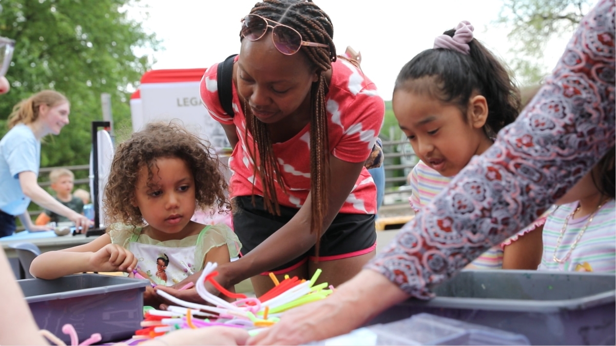 Children making crafts during Family Fun Day outside the Historic Gym on Friday, May 17. Photo by Brandon Mitchell/Eden Prairie Schools