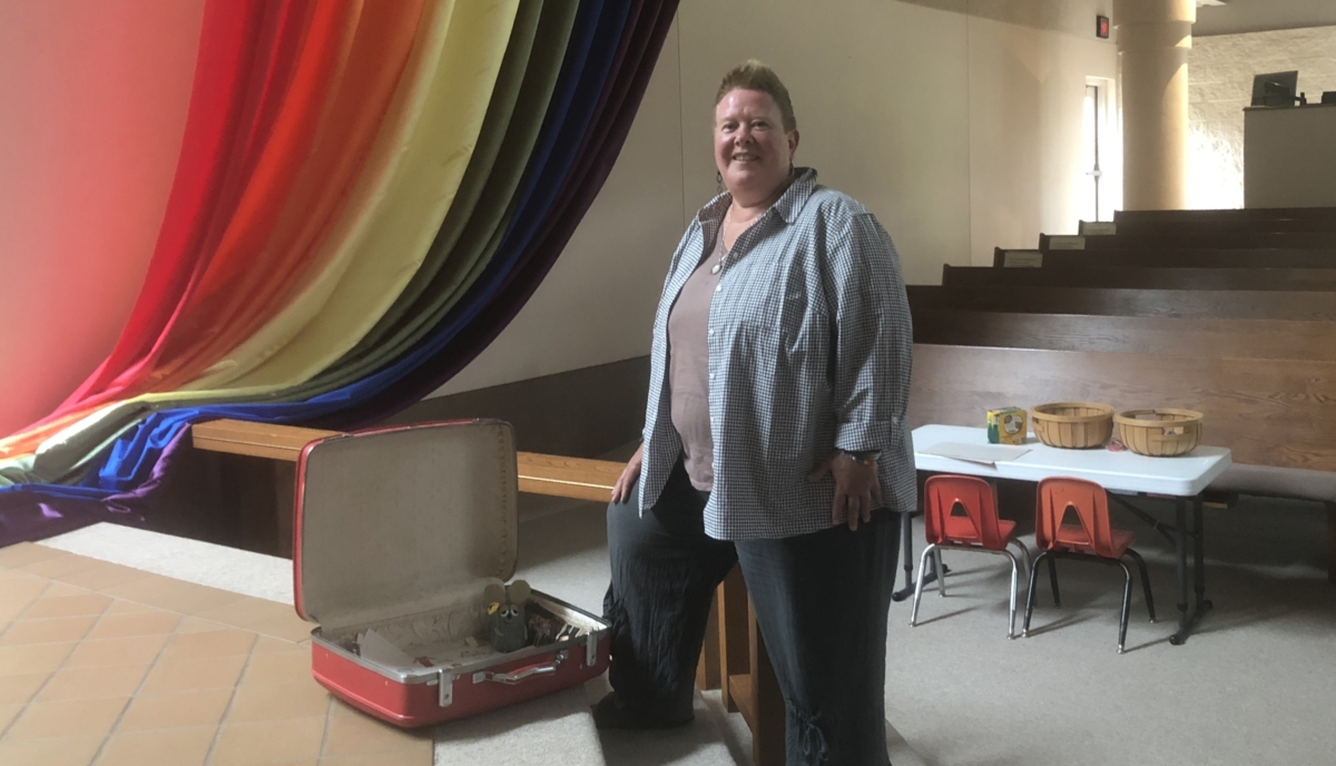 Pastor Linda McCollough, a collector of suitcases, is the new pastor of Eden Prairie United Methodist Church. She started the job and preached her first sermon on Sunday, June 30, Pride Day. Photo by Joanna Werch Takes