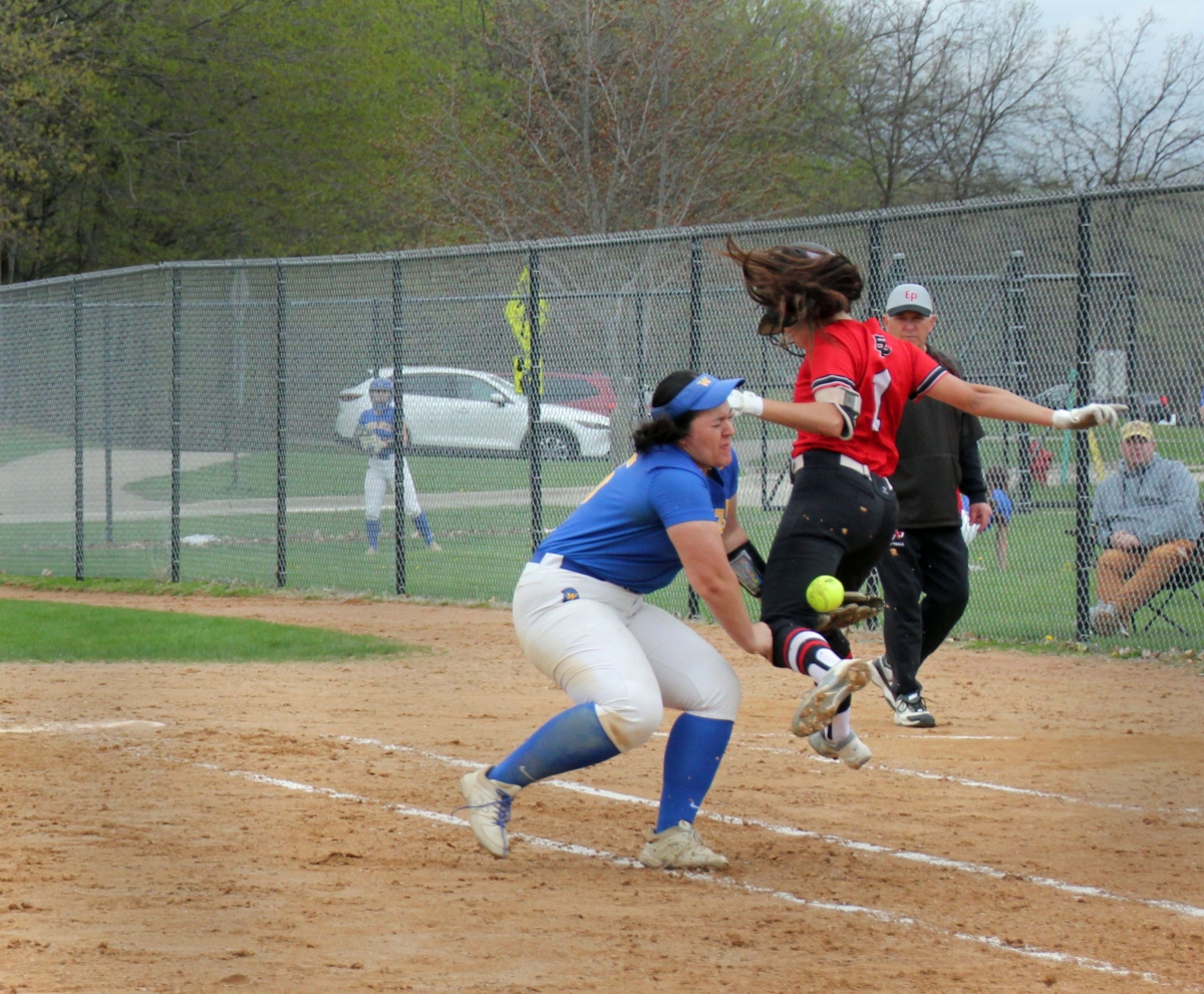 Eden Prairie junior Maya Miller wound up safe after this collision with the Wayzata first baseman in a 12-4 win May 6 at Miller Park. Photo by Laura Neuman