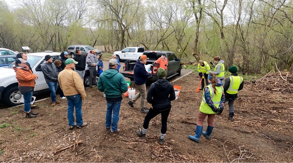 Volunteers prepare for planting seedlings in Birch Island Woods