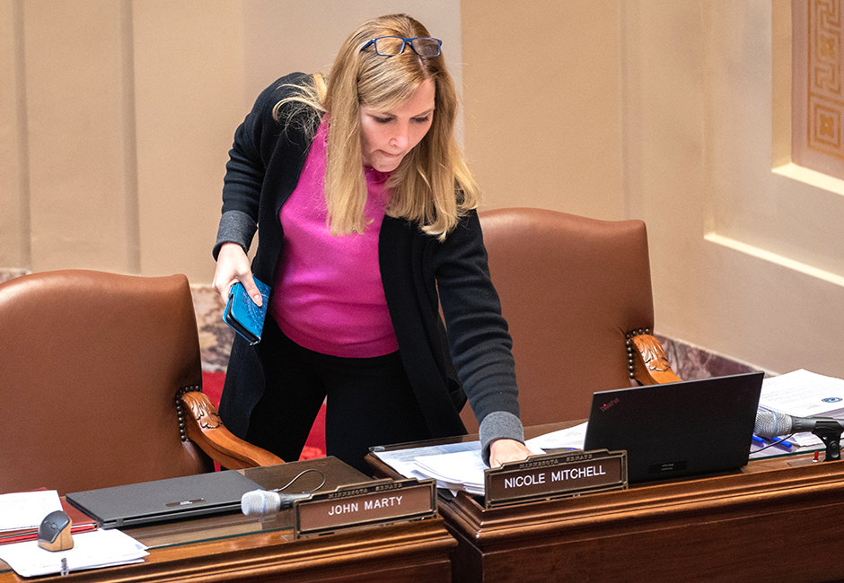 State Sen. Nicole Mitchell casting the deciding vote on the gun bill on Thursday. Credit: MinnPost photo by Tom Olmscheid