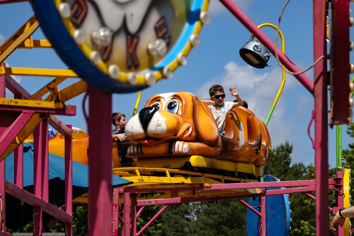 Riders on the Wacky Dog rollercoaster at Schooner Days on Saturday, June 1.