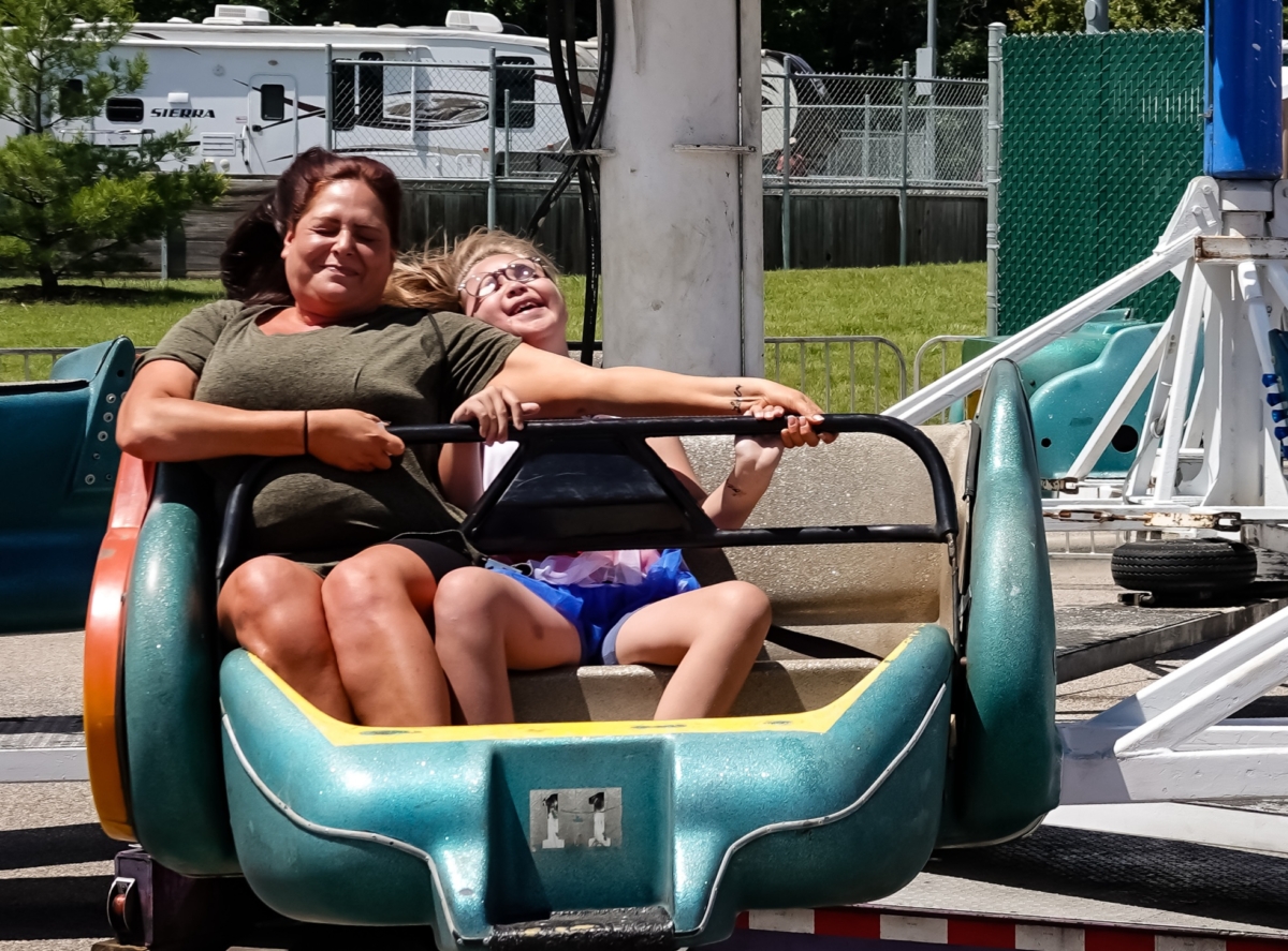 Rachel Boegeman rides the Sizzler with her daughter, Ella, at Schooner Days on Saturday, June 1. Photo by Gretchen Haynes
