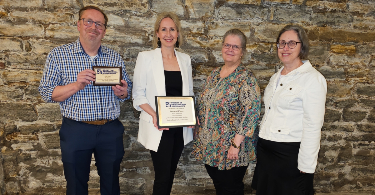 EPLN staff Stuart Sudak, Juliana Allen, Amy Nylander, and Joanna Werch Takes display awards received for Headlines and Story of the Year for the Silent Struggles series. Photo by Rick Olson