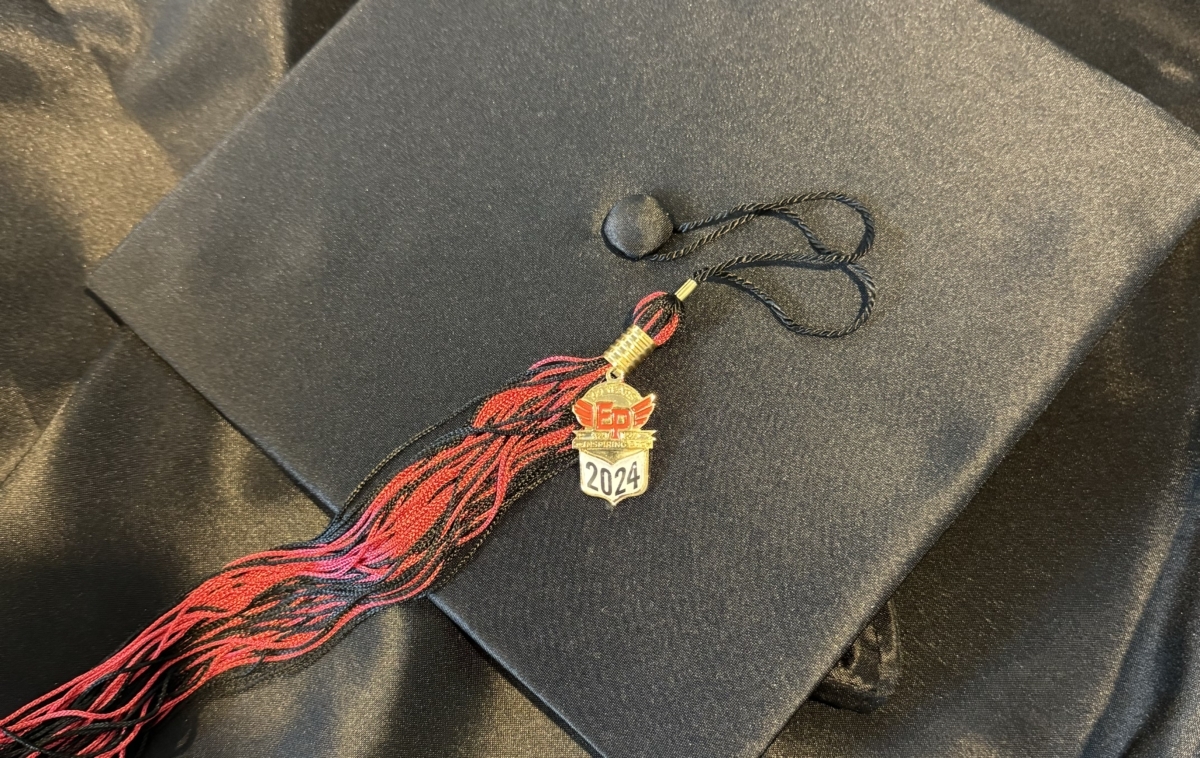 An Eden Prairie High School Class of 2024 graduation cap, gown, and special 100-year commemorative tassel. Photo by Juliana Allen